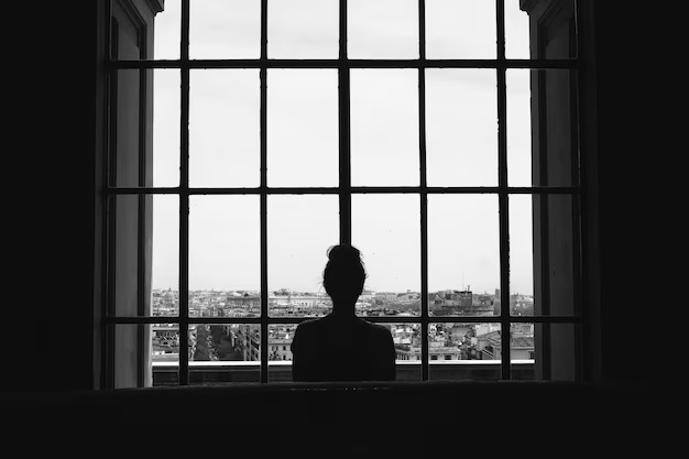 black-white-shot-lonely-female-standing-front-windows-looking-buildings_181624-26508.jpg